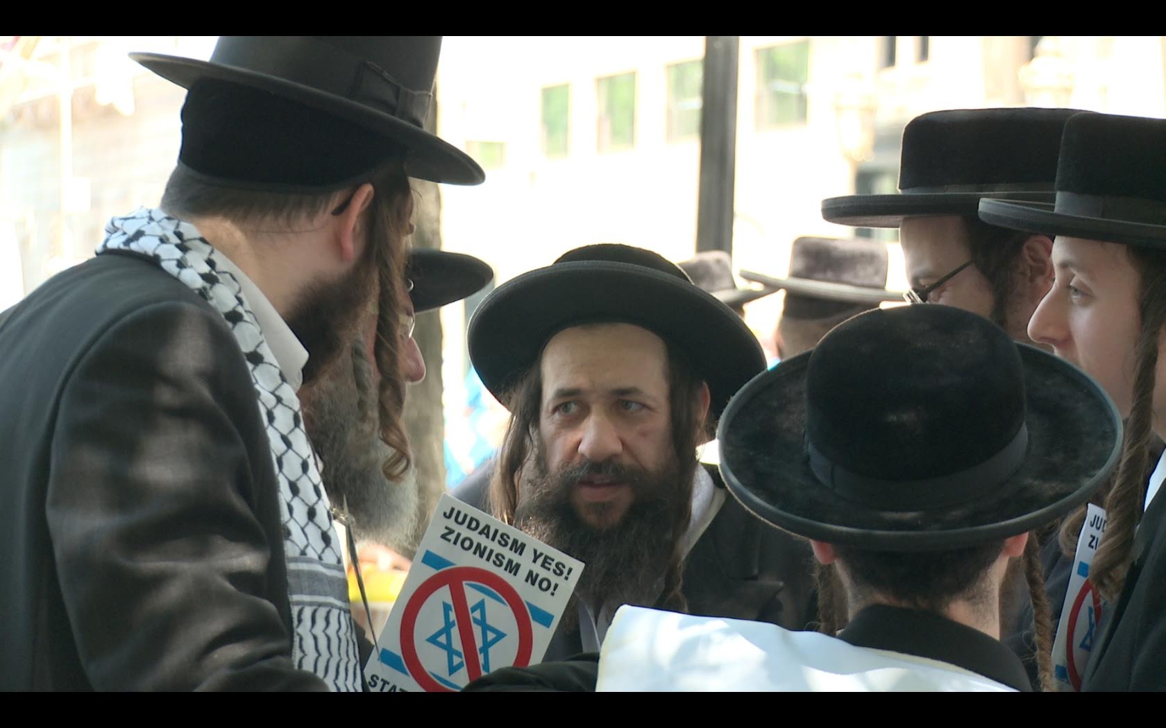 a group of rabbis standing together and talking