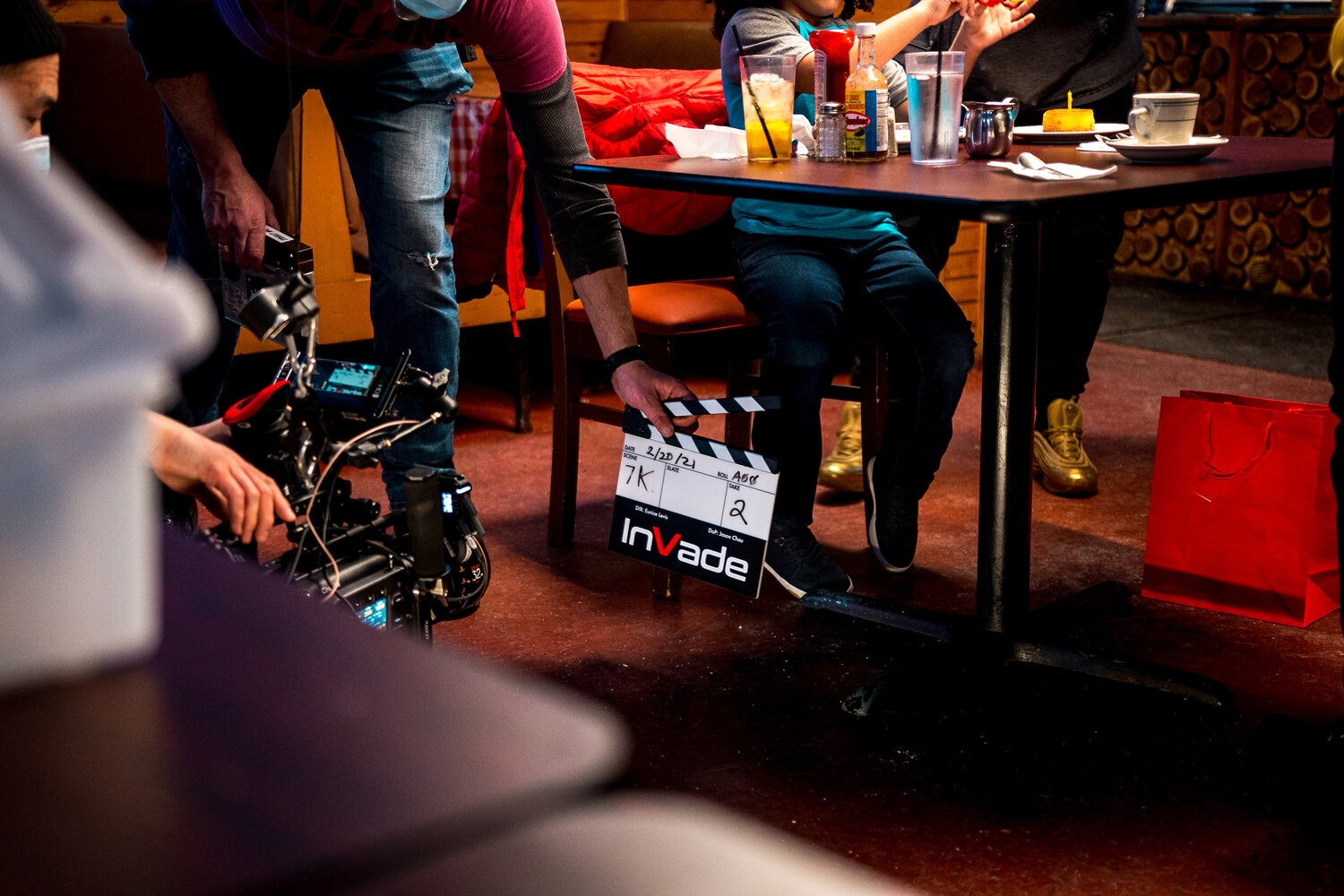 a behind-the-scenes photo of a film slate that reads: InVade