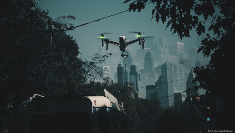 A drone hovering over a SEPTA trolley