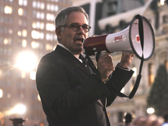 a man using a bullhorn to speak