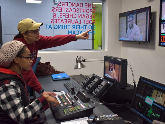 two people working on production of a TV show