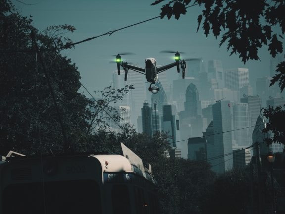 A drone hovering over a SEPTA trolley