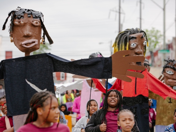 children hold puppets and march at Spiral Q 2024 Blankenburg Parade